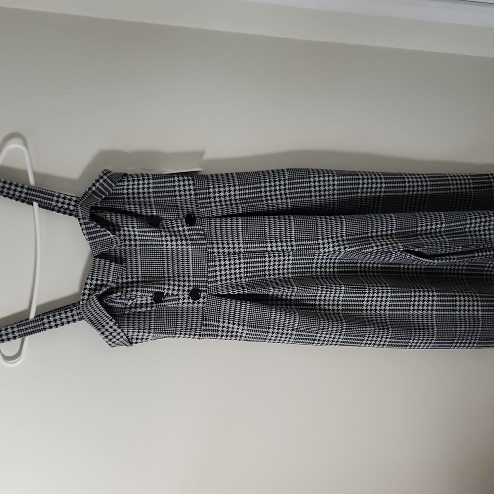 Retro romper with light grey and black stitching.